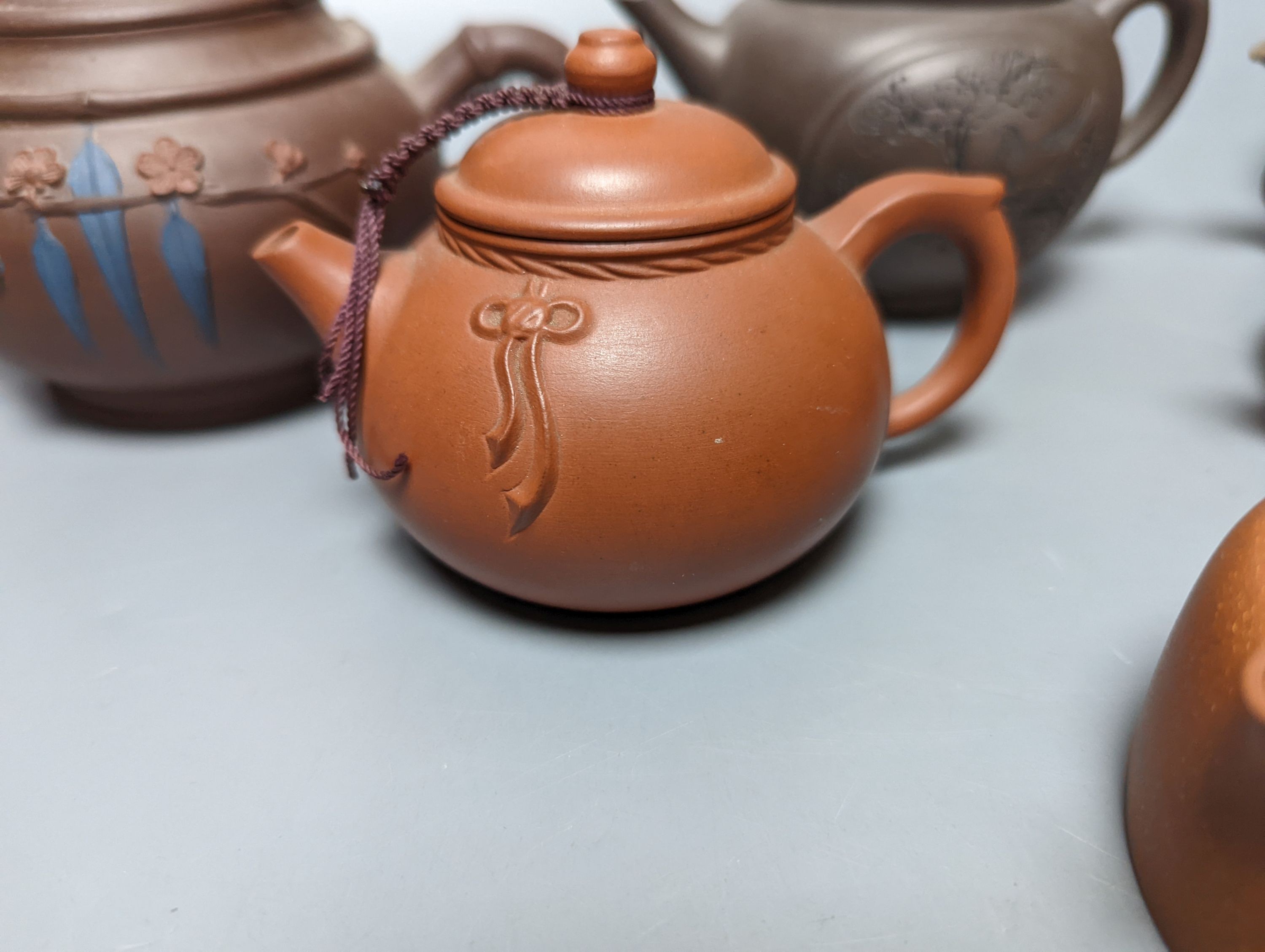 A Chinese stoneware 'cash' teapot and cover and five Yixing teapots (6)